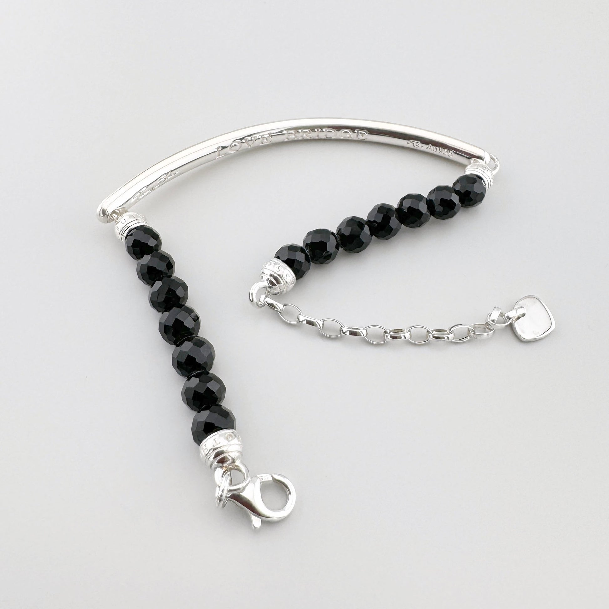 Bracelet Thomas Sabo en obsidienne noire avec barre centrale argentée et perles facettées