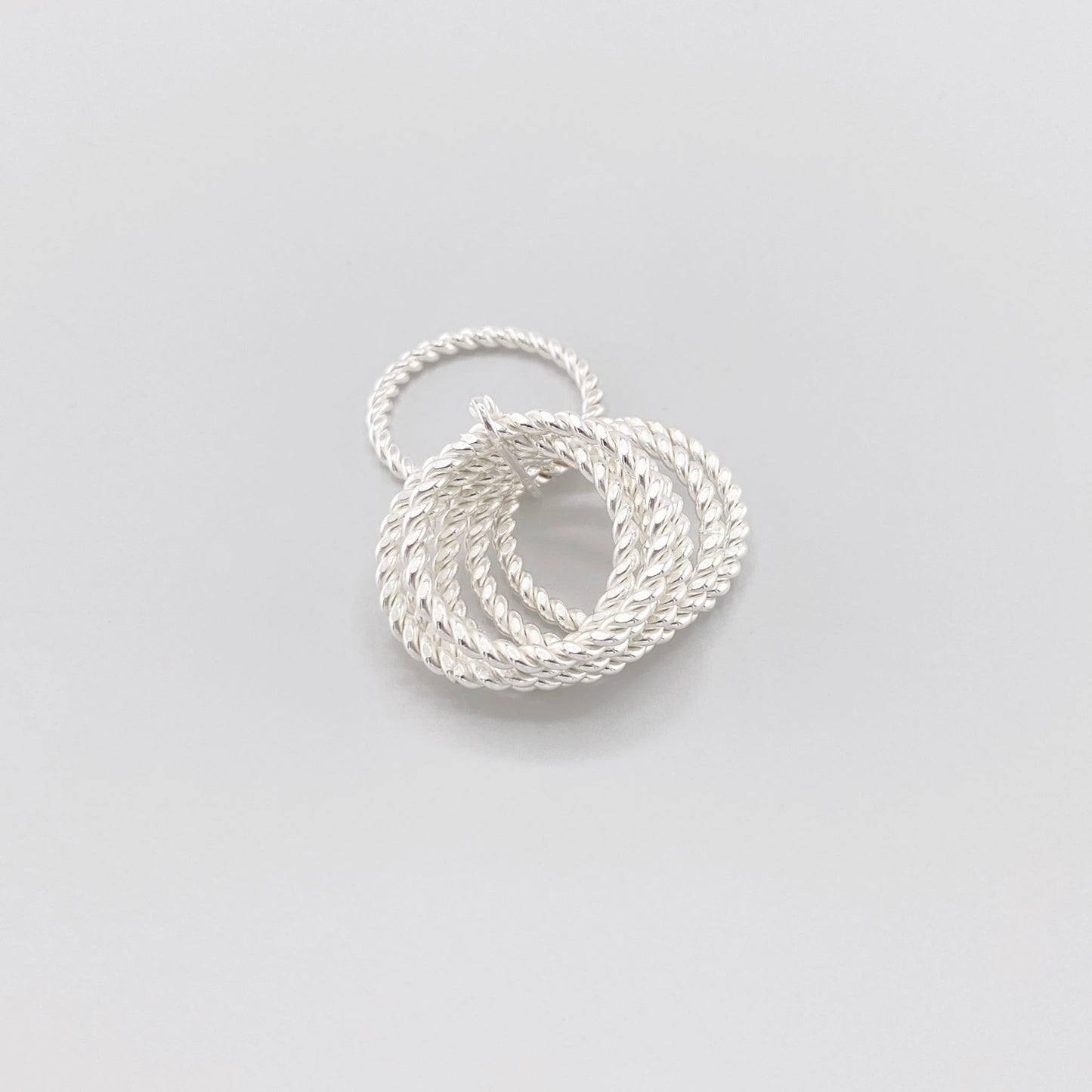 Twisted sterling silver ring by Clio blue with layered rope-textured bands
