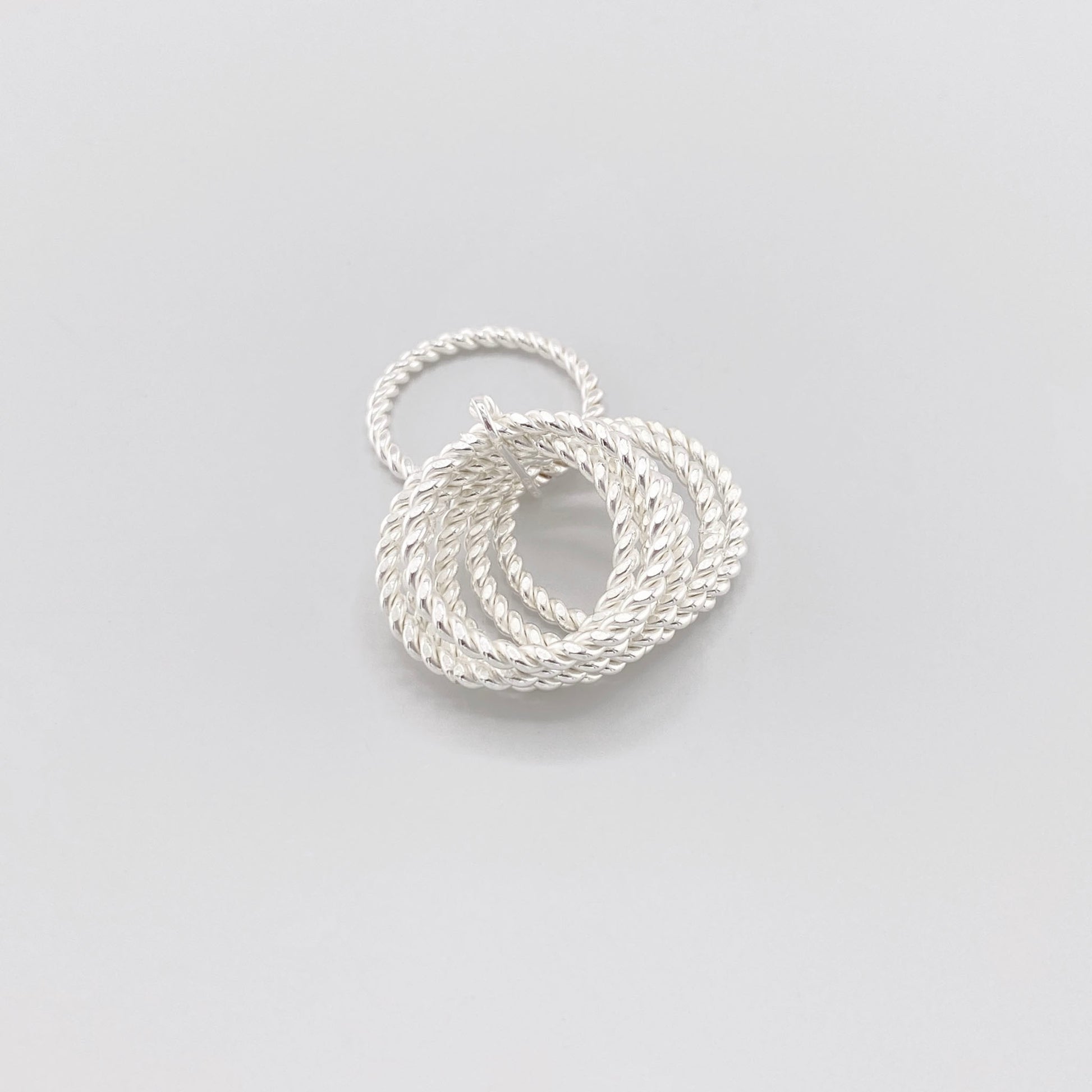 Twisted sterling silver ring by Clio blue with layered rope-textured bands