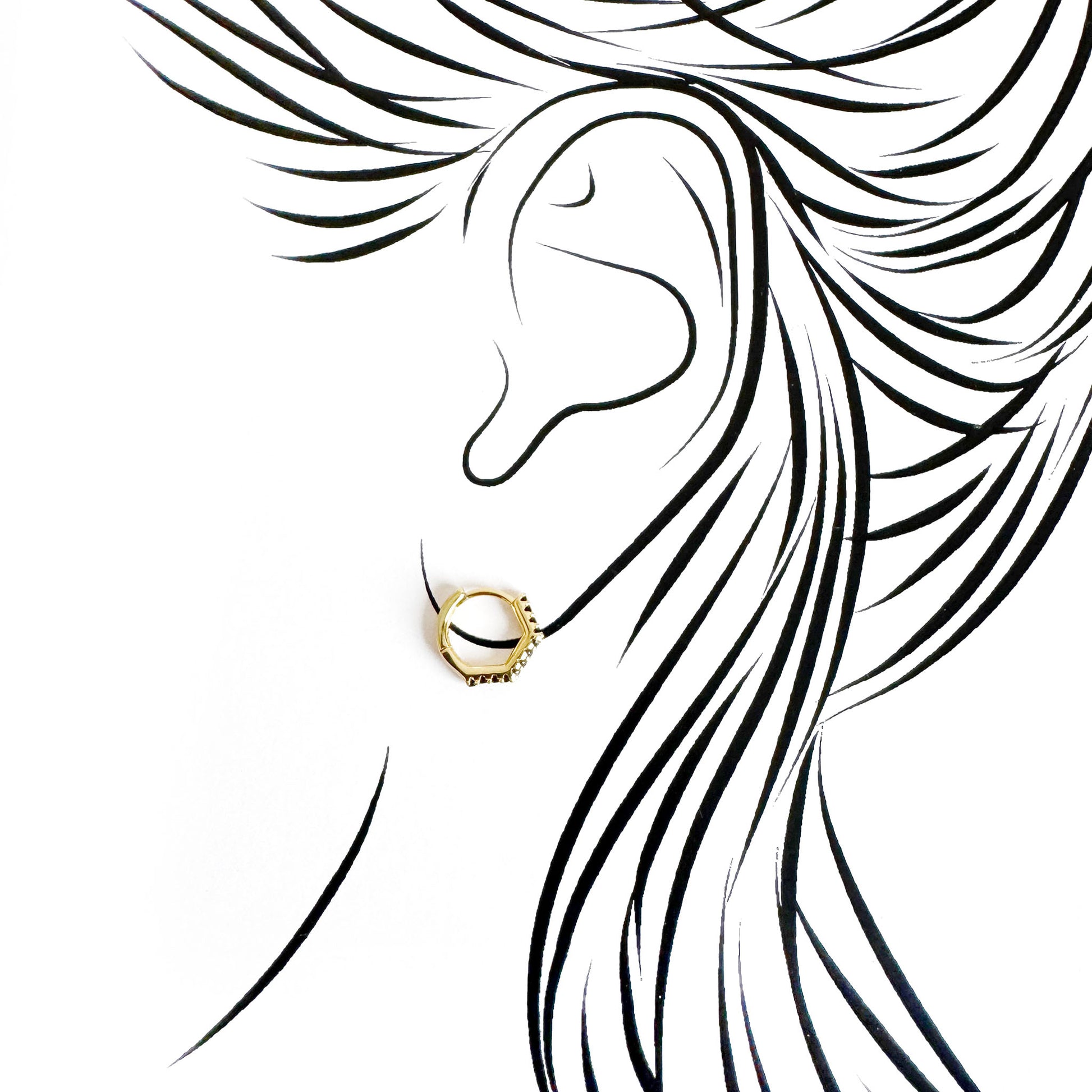 Single gold-tone hoop earring Earcandy worn on the ear with black zirconia detail