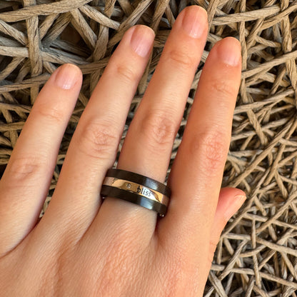 Steel and wood ring by Bliss Gioielli worn on the hand