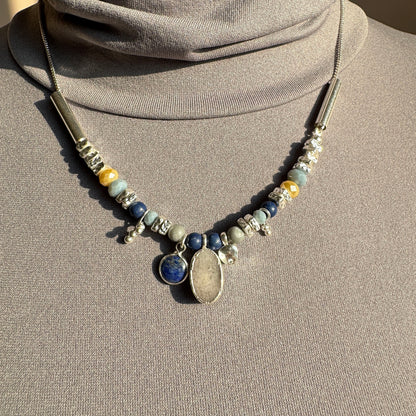 Stone necklace with lapis lazuli and quartz by Pilgrim displayed on a mannequin