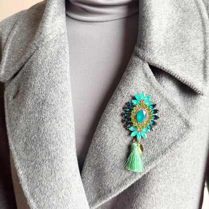 Tassel brooch Sonata worn on a blazer with turquoise crystals and a mint tassel