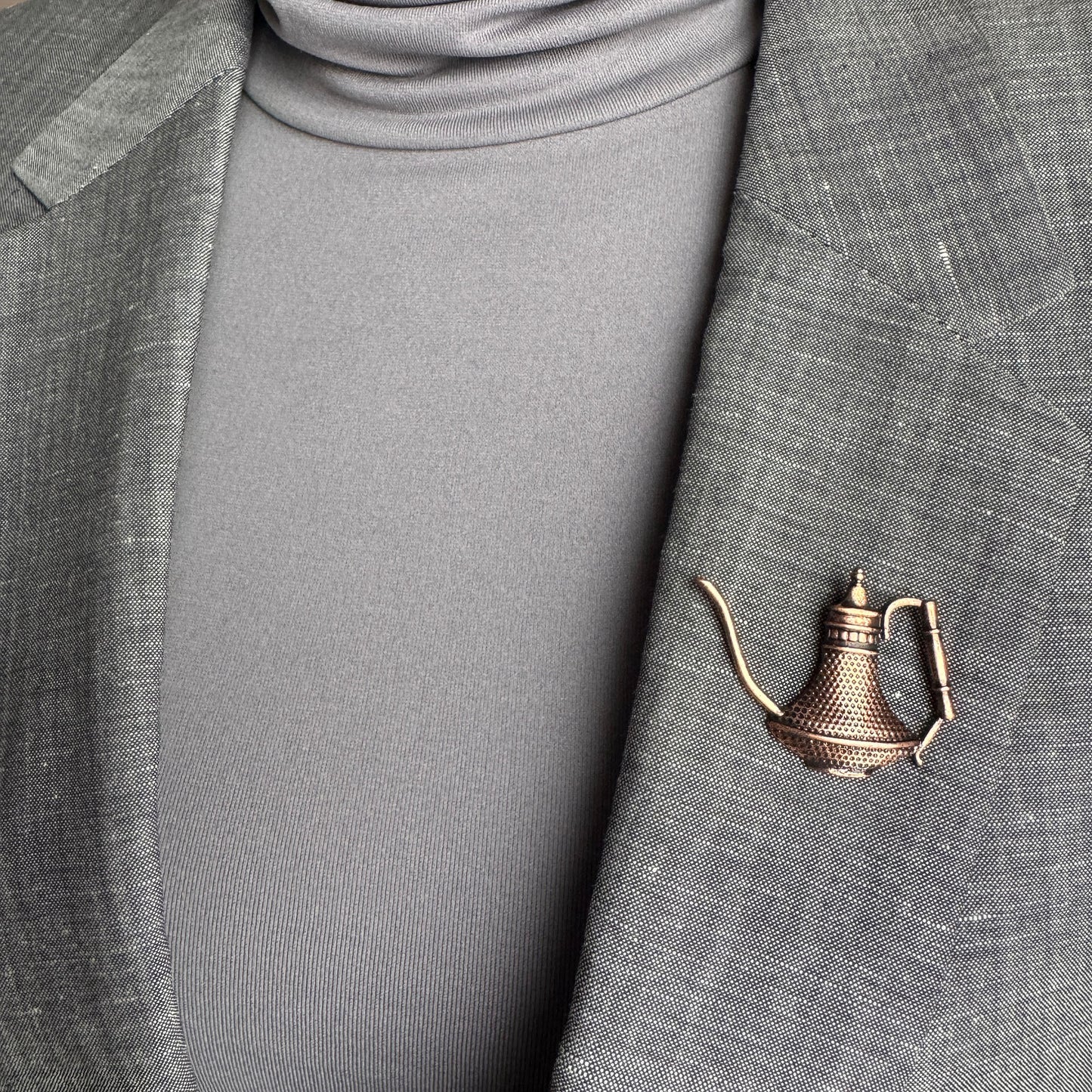 Oriental teapot brooch Sonata worn on a blazer with a warm vintage metal finish