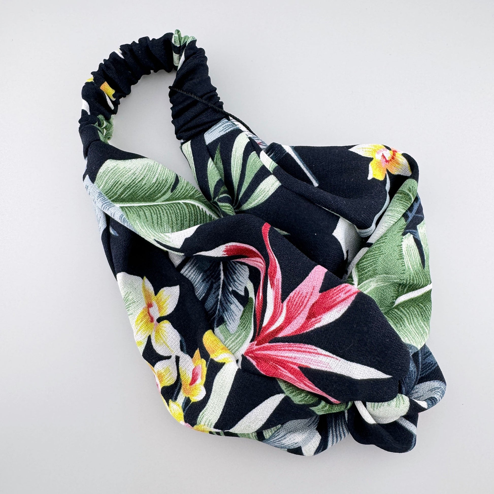 Tropical floral headband by IRL with a soft elastic fabric and twist detail