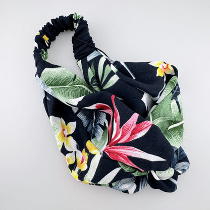Tropical floral headband by IRL with a soft elastic fabric and twist detail