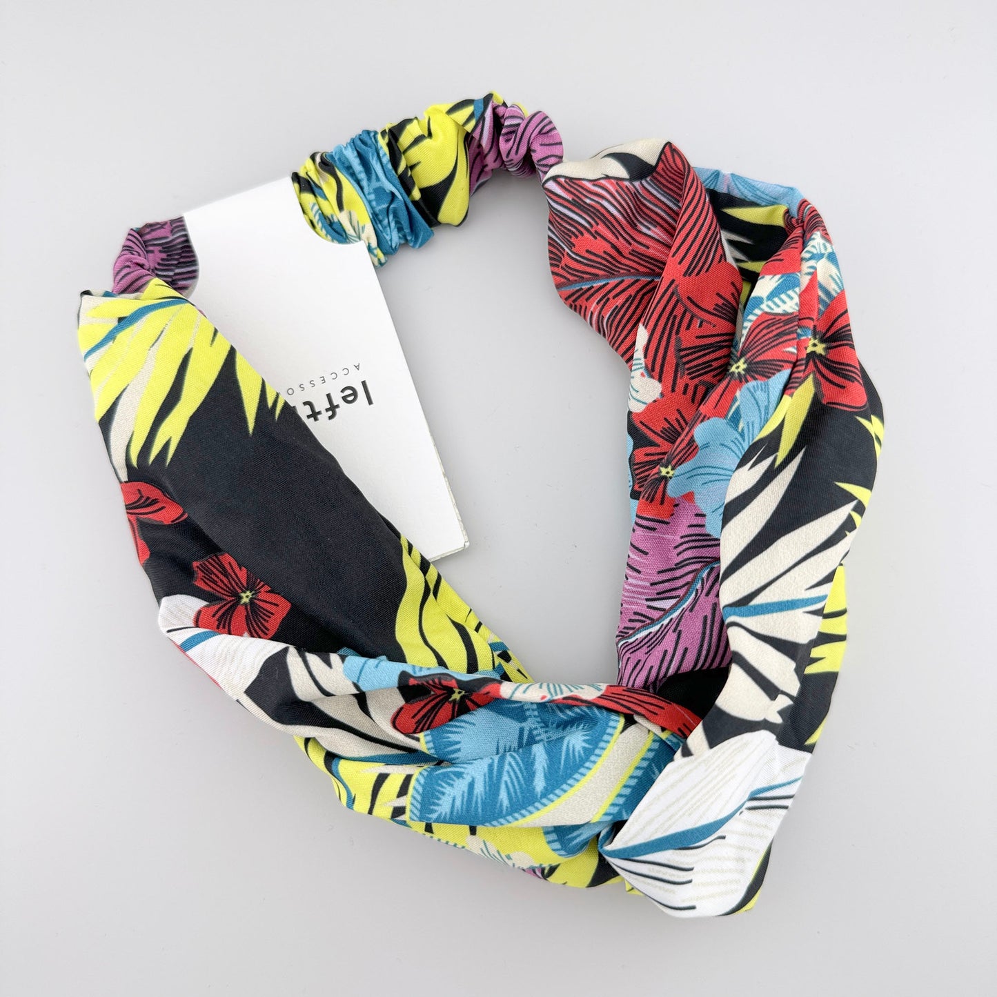 Tropical patterned Lefties headband with a colorful twist and soft stretch