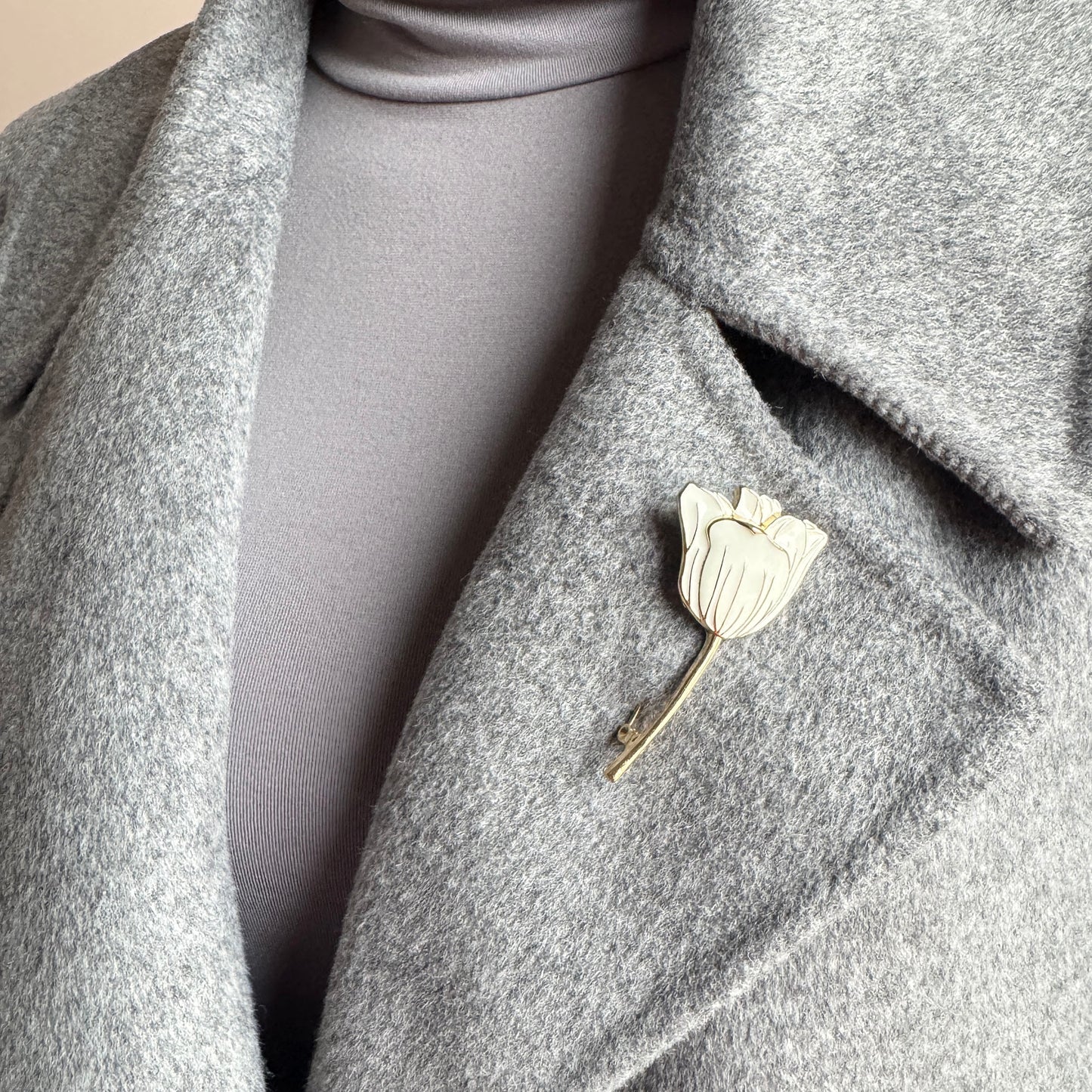 Tulip brooch Sonata worn on a coat with cream enamel and a gold-tone finish