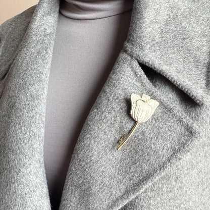 Tulip brooch Sonata worn on a coat with cream enamel and a gold-tone finish