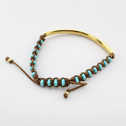 Gold-plated Thomas Sabo Love Bridge bracelet with turquoise stones and a warm brown adjustable cord