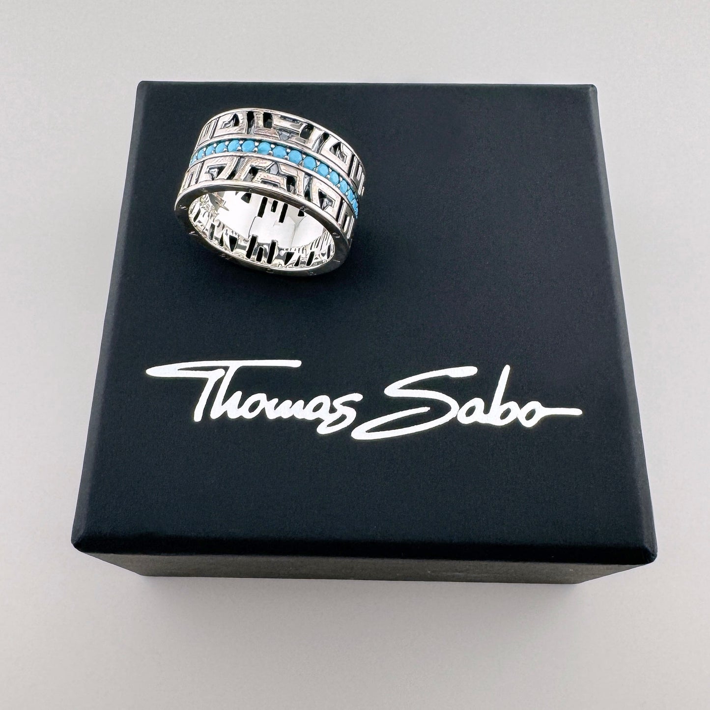 Silver turquoise ring Thomas Sabo displayed on a branded black box