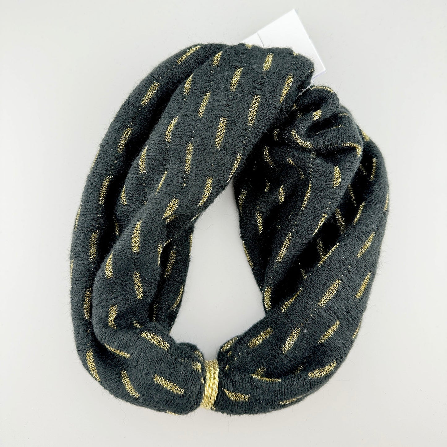 Black twisted headband with subtle gold thread shimmer in the fabric