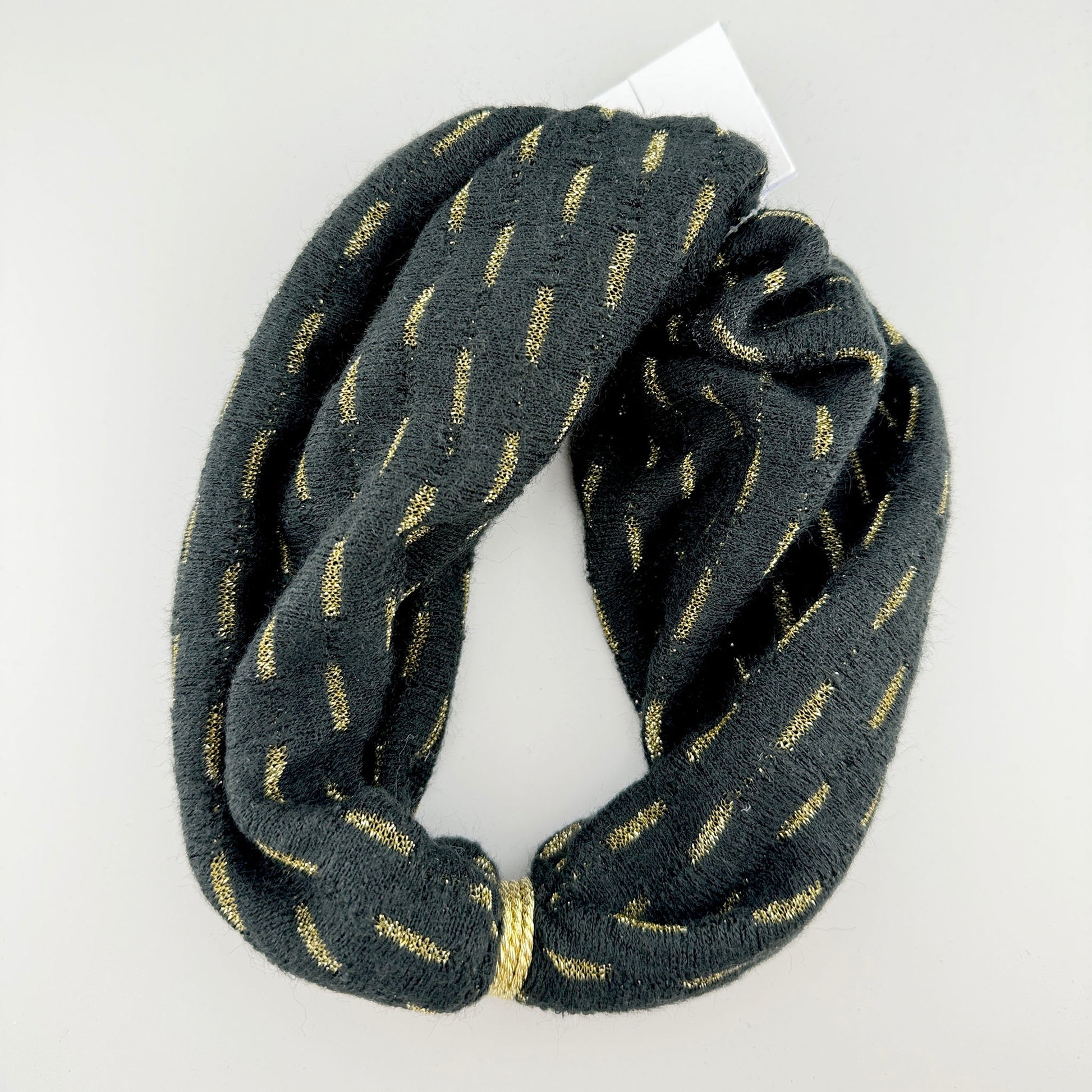 Black twisted headband with subtle gold thread shimmer in the fabric
