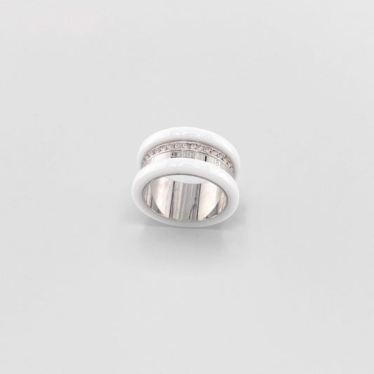 White ceramic ring by Cerruti 1881 with a wide band, silver-tone detailing, and engraved logo