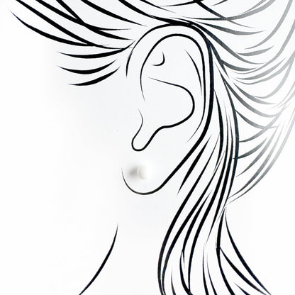 White ceramic stud earrings Sonata worn on the ear with a clean minimalist look