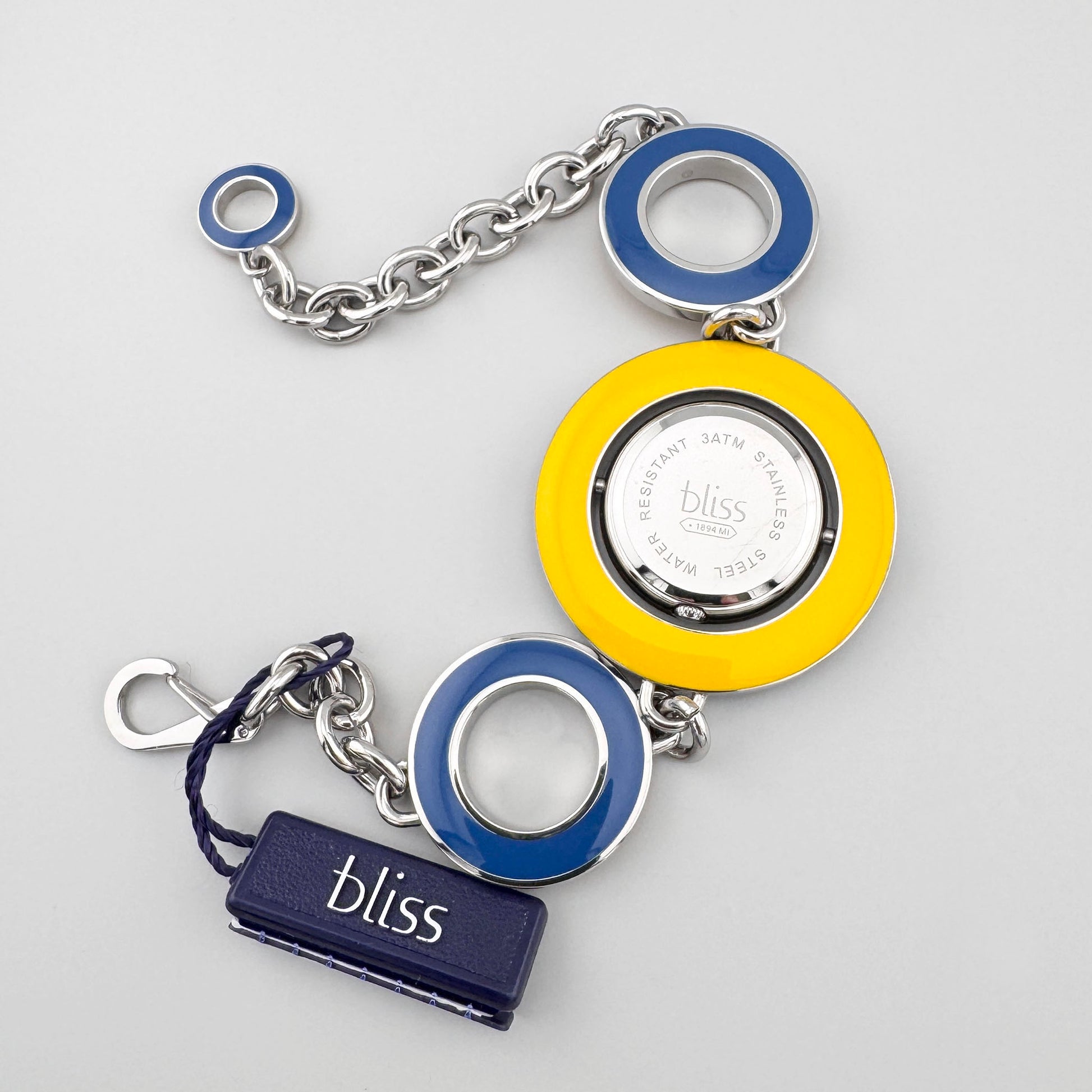 Detail of yellow enamel reversible bracelet watch