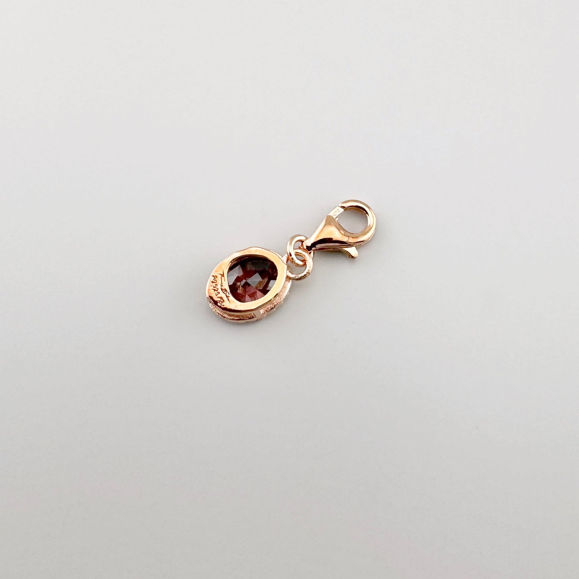 Charm Thomas Sabo avec zircone ovale et fermoir mousqueton au ton or rose