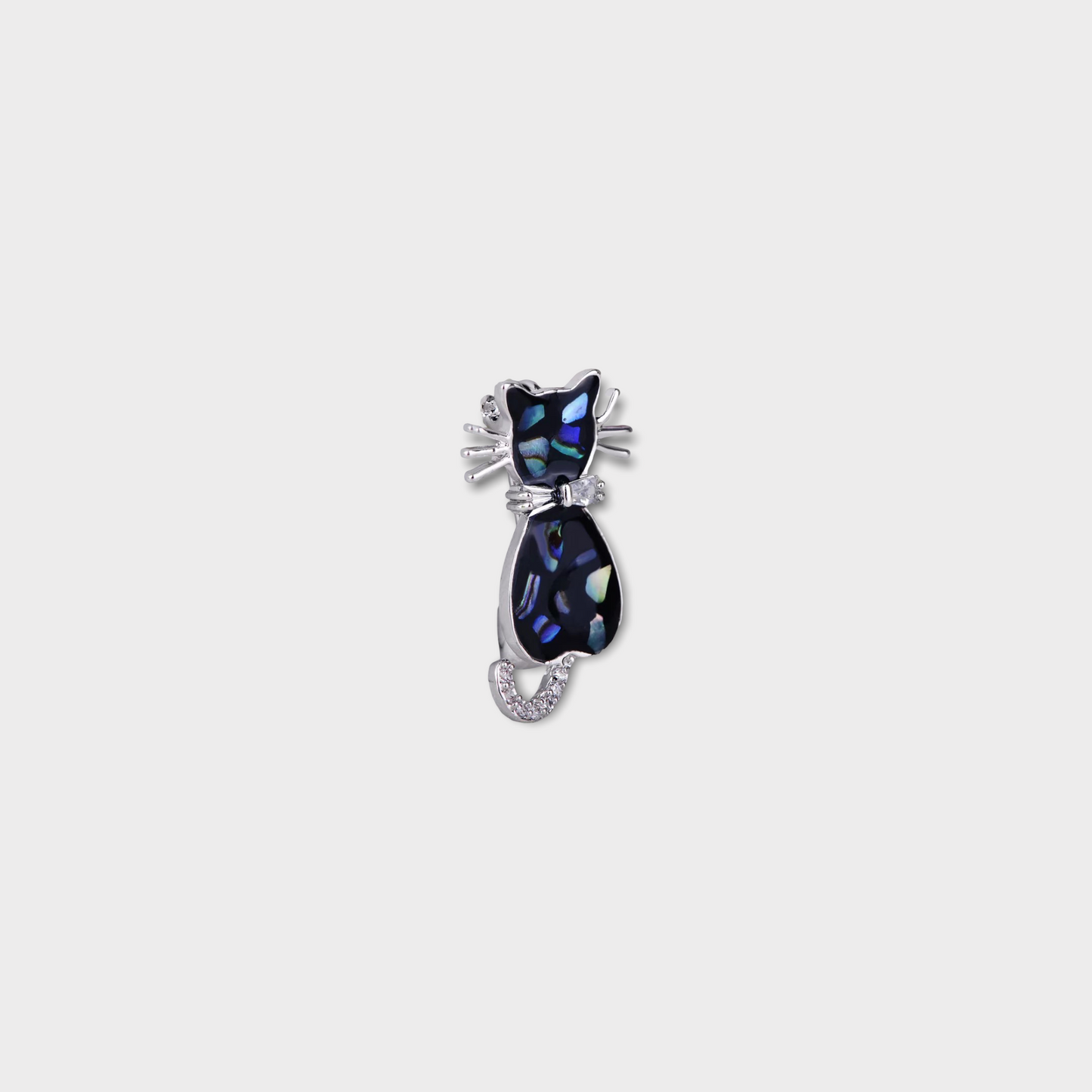 A small brooch in the shape of a cat