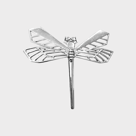 A large brooch in the shape of a dragonfly