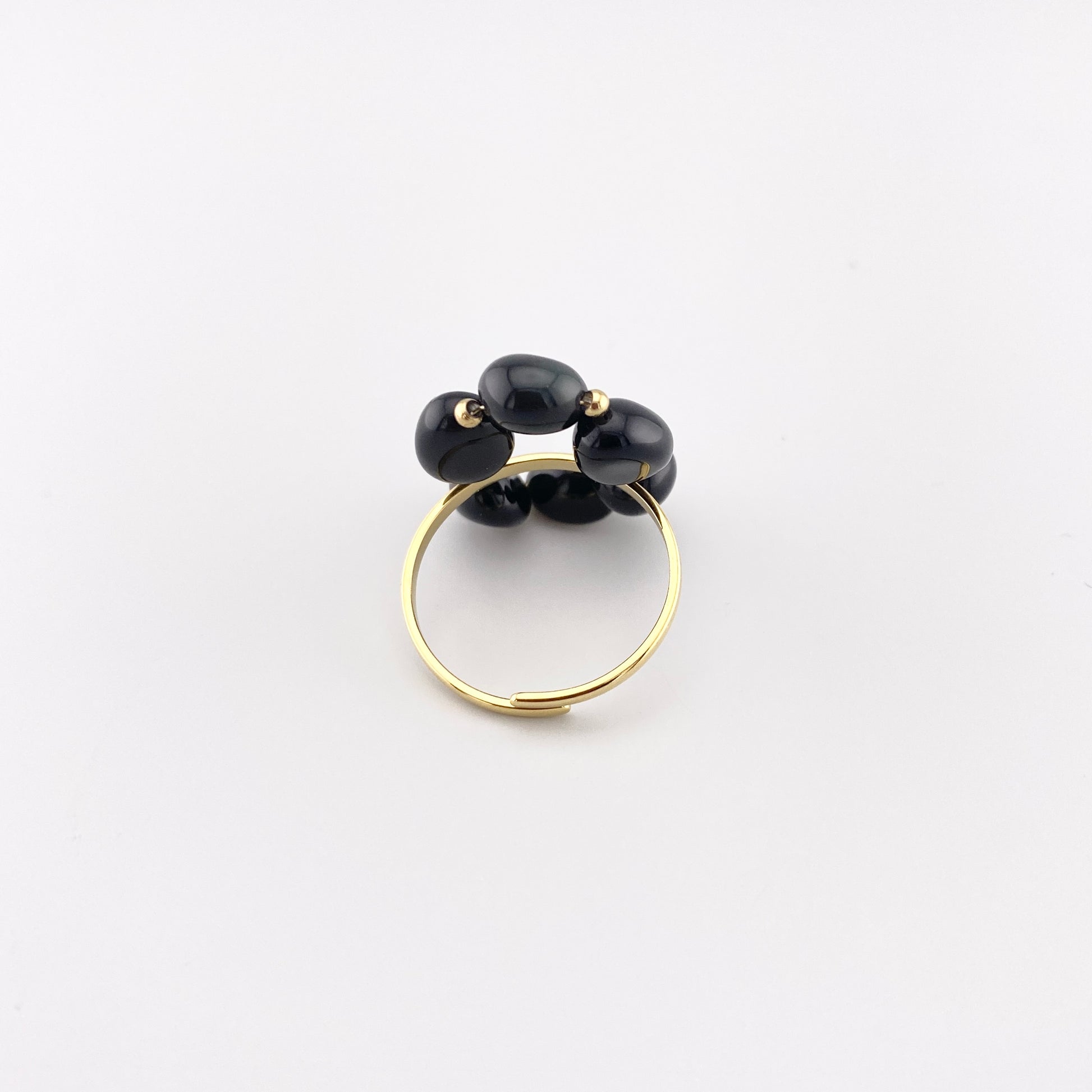 IRL ring with natural onyx displayed with branded pouch