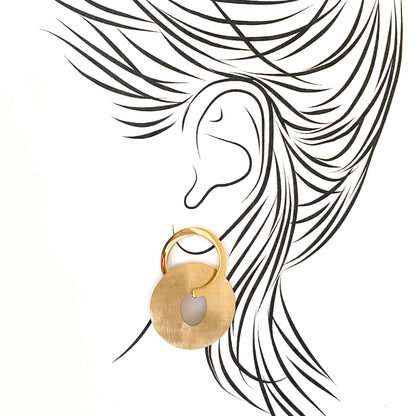 Sculptural oval earrings with brushed finish gently hugging the earlobe