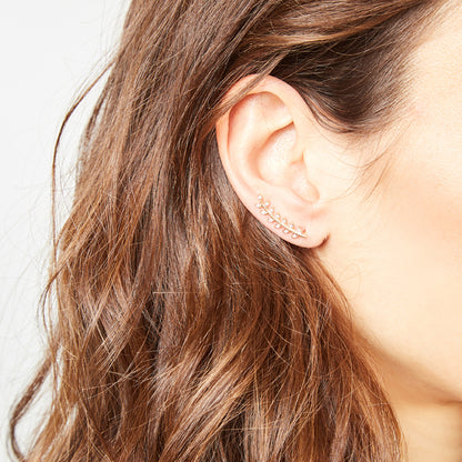 IRL gold‑tone ear cuffs on ear, delicate leaf shape with sparkling zircons