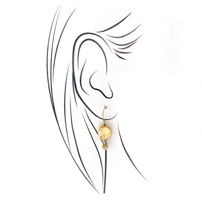 Bohm yellow faceted crystal drops with gold-tone setting and a small charm, airy movement